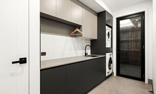 Laundry area with cabinets