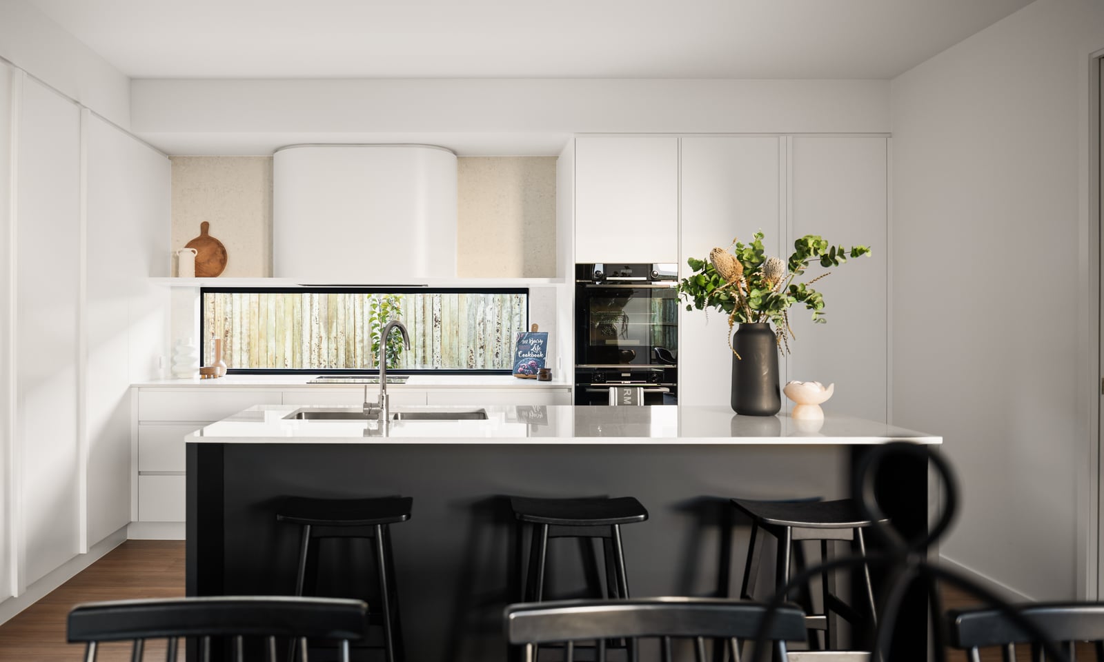 Project Ward (Black island with white benchtop, white cabinetry and a horizontal window splashback)