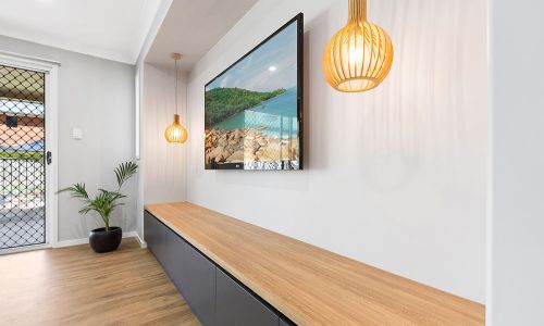 wooden modern stationary with wall tv