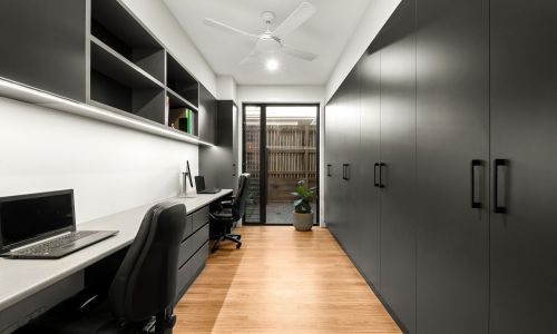 Long office table with black cabinet on right side