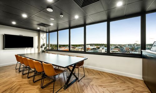 conference table with chairs and conference tv