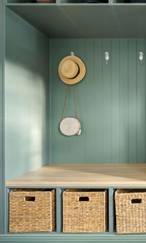 Mudroom close up with a vacation hat hanging by the wall
