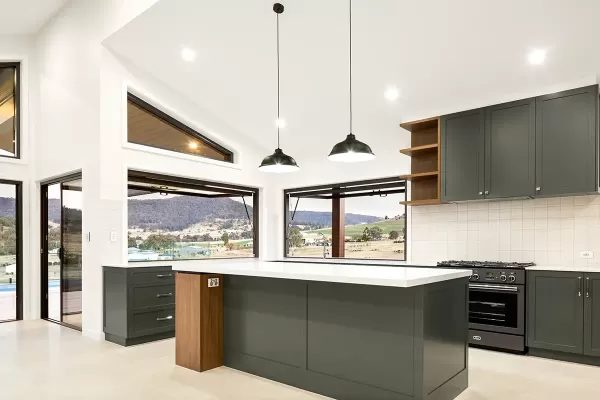 Modern kitchen with dark cabinets and mountain view