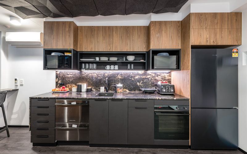 Remax kitchen in black and wooden theme