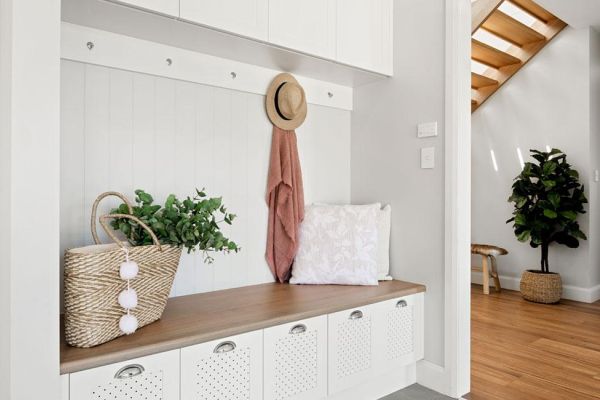 Trafalgar house mudroom in white and wooden seat