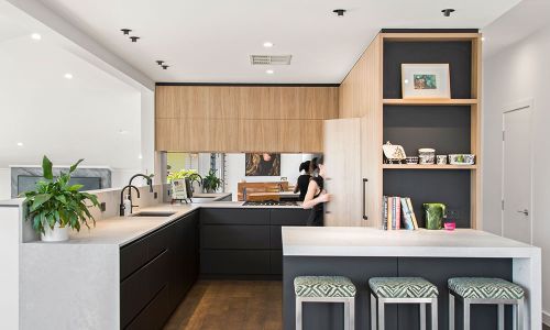 compact kitchen space with sink and ingredient cabinets