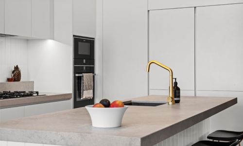 gold colored faucet kitchen table