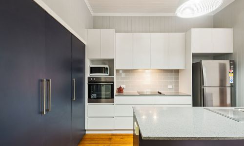 large kitchen cabinet and white top table