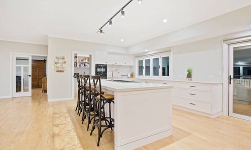 white kitchen table with black chairs