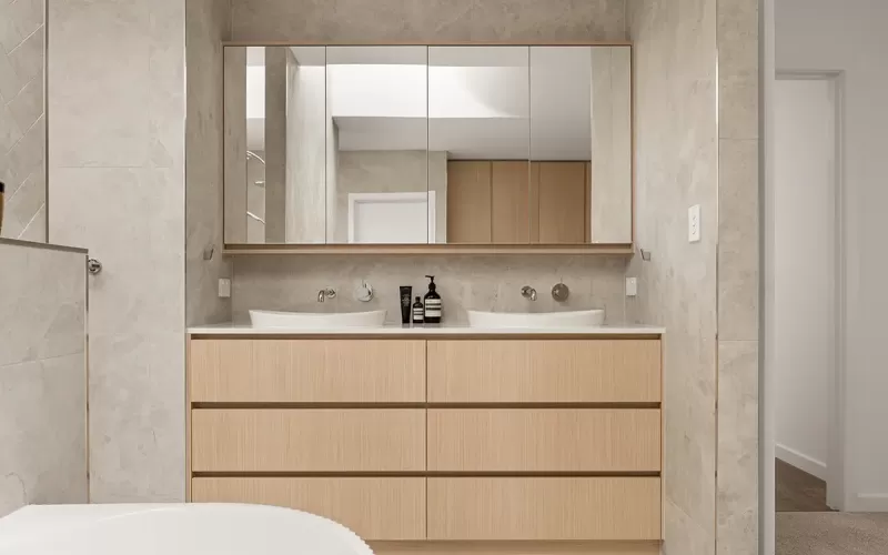 Modern bathroom with double sink and wood vanity