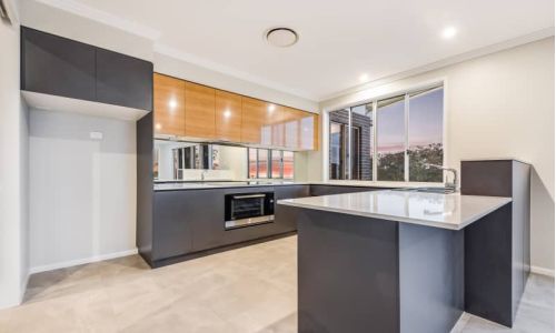spacious kitchen area with modern design furniture