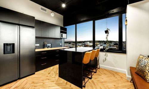 kitchen table with high chairs and window view