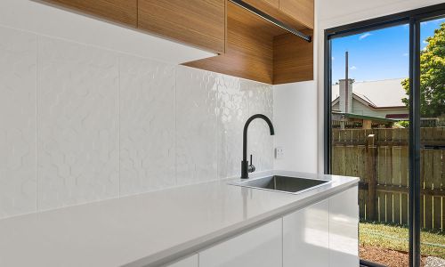 laundry area sink and cabinets