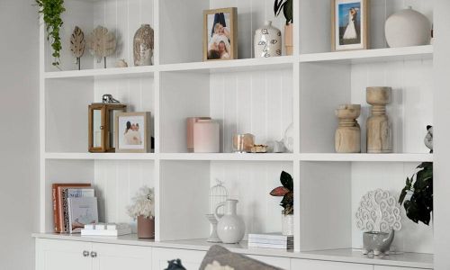White Bookshelf of Trafalgar house with frames and vases