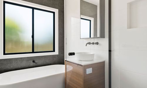 bathroom bathtub with outside window