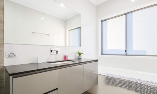 bathroom bathtub and cabinet with mirror
