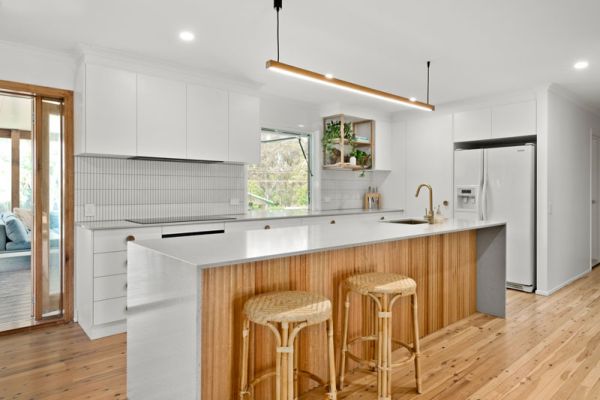 kitchen with wooden floor and chairds