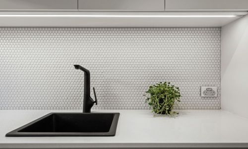 black sink and white wall