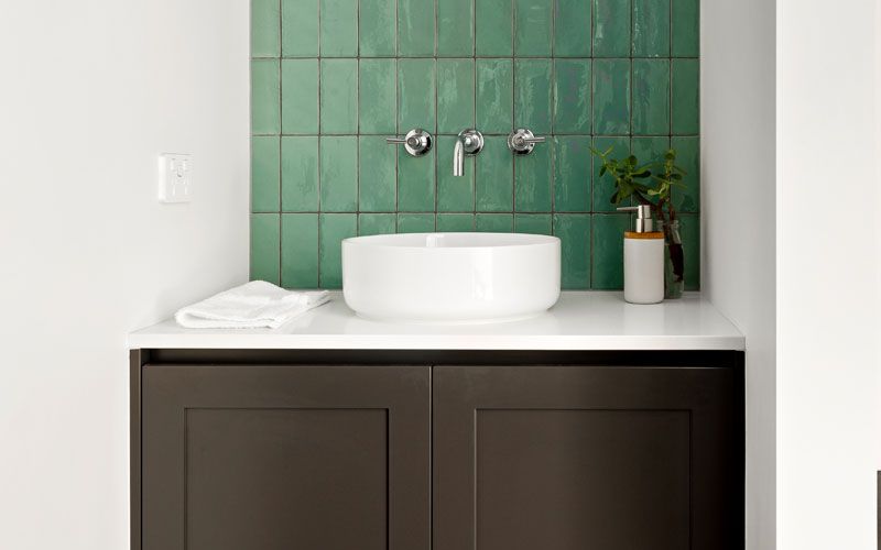 green wall tiled sink