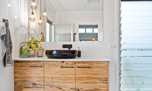 black washroom sink with glass mirror