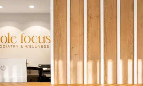 Wood-panel detail with decor near reception counter.