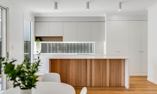 dining area view white cabinets and kitchen