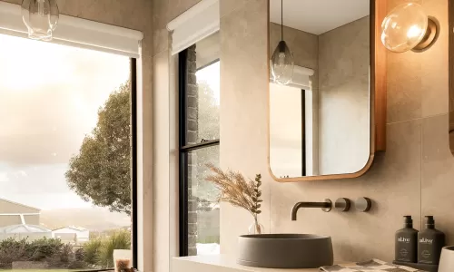 Elegant bathroom with a freestanding tub, large windows, wooden vanity, round sink, and pendant lights