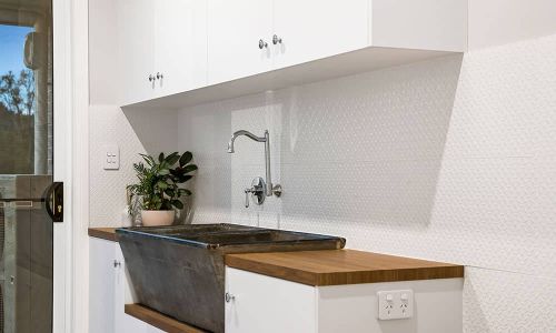 black sink and white cabinet