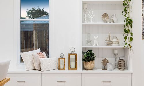 single window with white organizer and cabinet