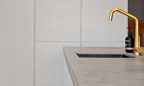 side view gold colored faucet