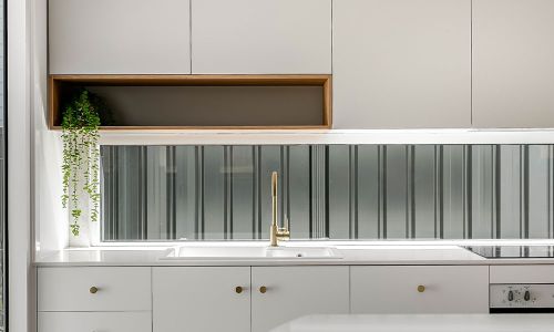 white kitchen cabinet and large glass window