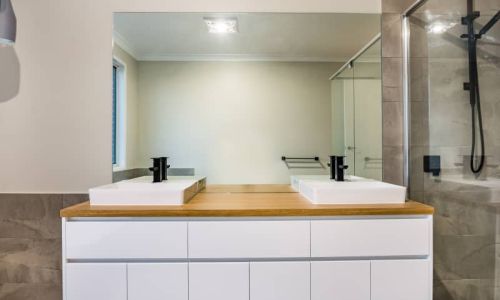 two sinks and large mirror