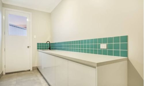 green tiled laundry area
