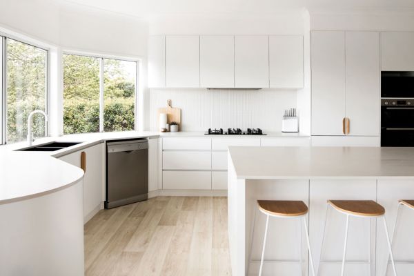kitchen with white themed design half view