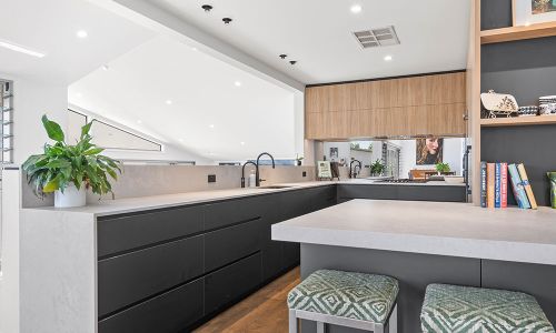 black modern kitchen cabinets and book divider
