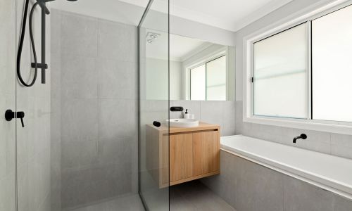 Full view of black, white and grey bathroom
