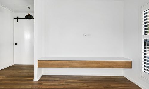 white walled with wooden stationary
