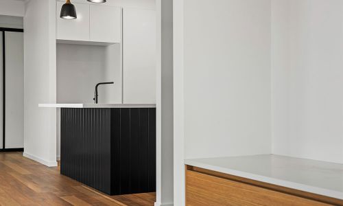 white walled and wooden floor kitchen design
