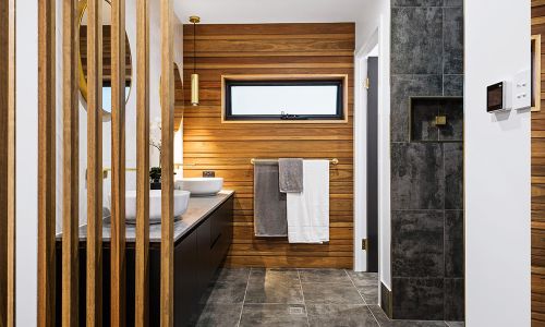 bathroom area with wooden wall divider