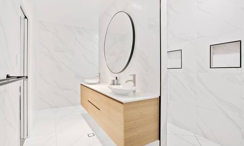 bathroom sink with circular mirror